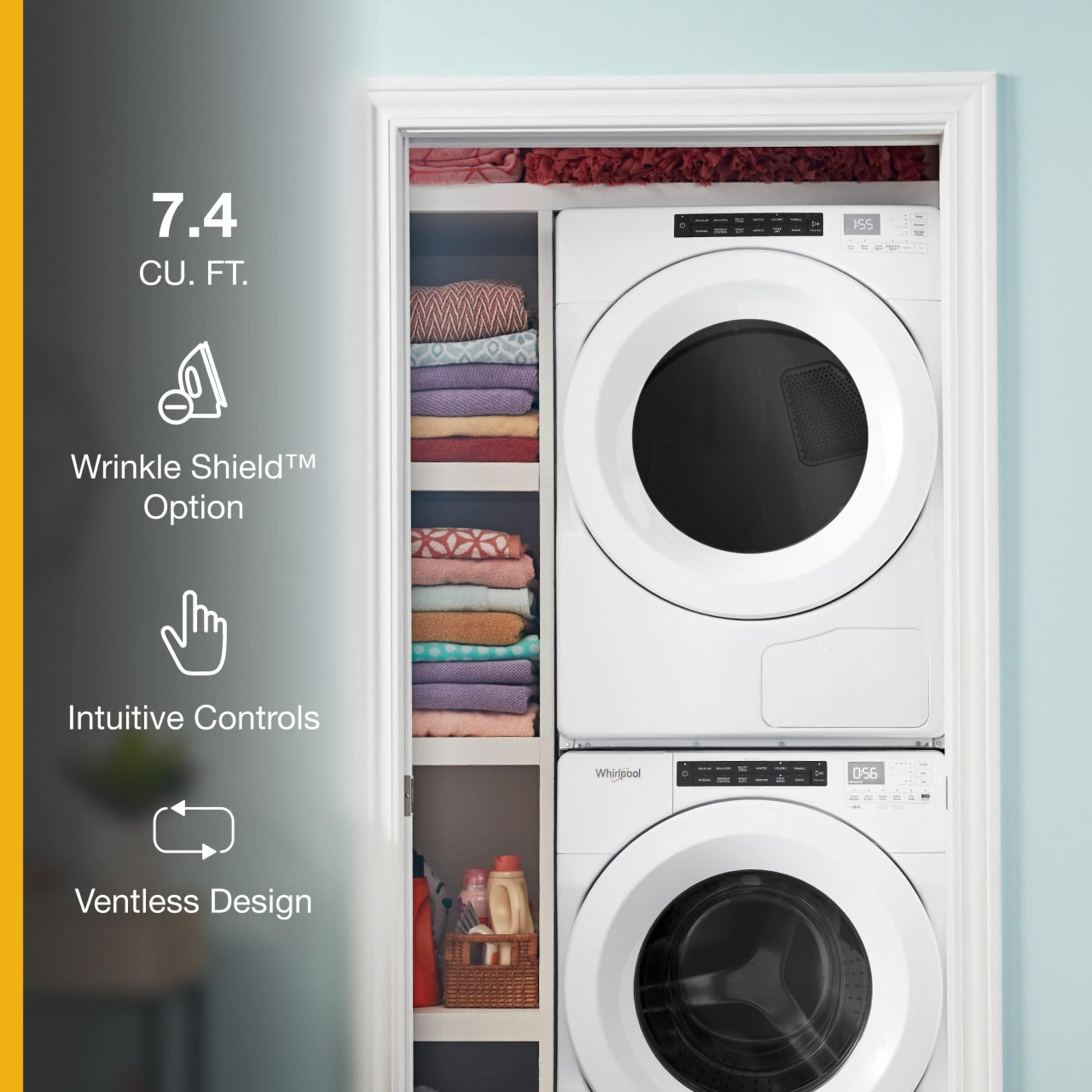 Stacked white front-load dryer and washer side by side in closet with folded towels and laundry items nearby