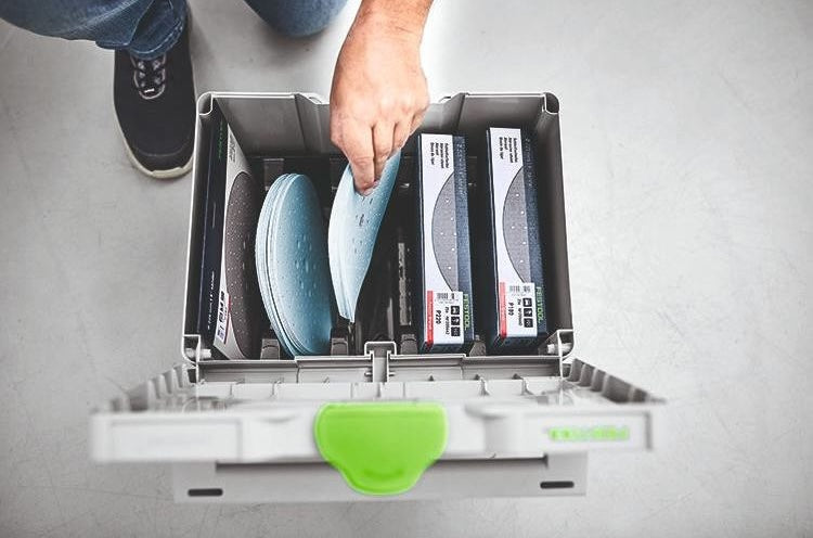 Gray plastic interlocking storage box organizing sanding discs and abrasive accessories for woodworking tool storage systems