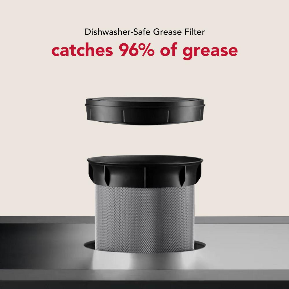Grease filter designed to catch 96 percent of grease, dishwasher-safe, shown partially removed from downdraft vent system