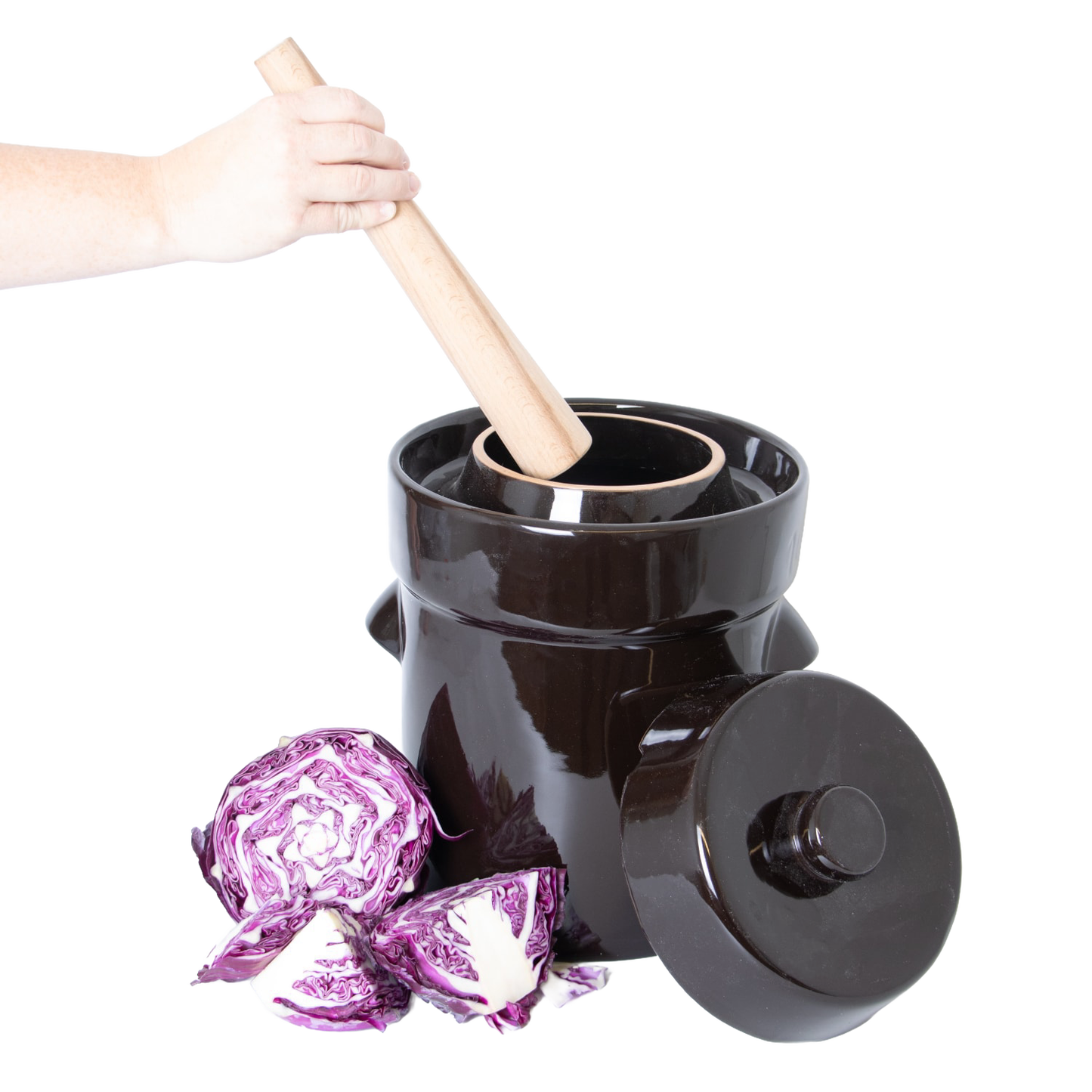 Light wooden dual-sided stomper tool inside a dark ceramic crock with purple cabbage for kitchenware under $50 collections