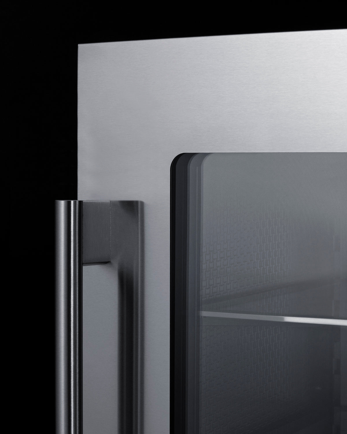 Stainless steel beverage center door with vertical handle and glass panel revealing interior shelving in kitchen appliance setting