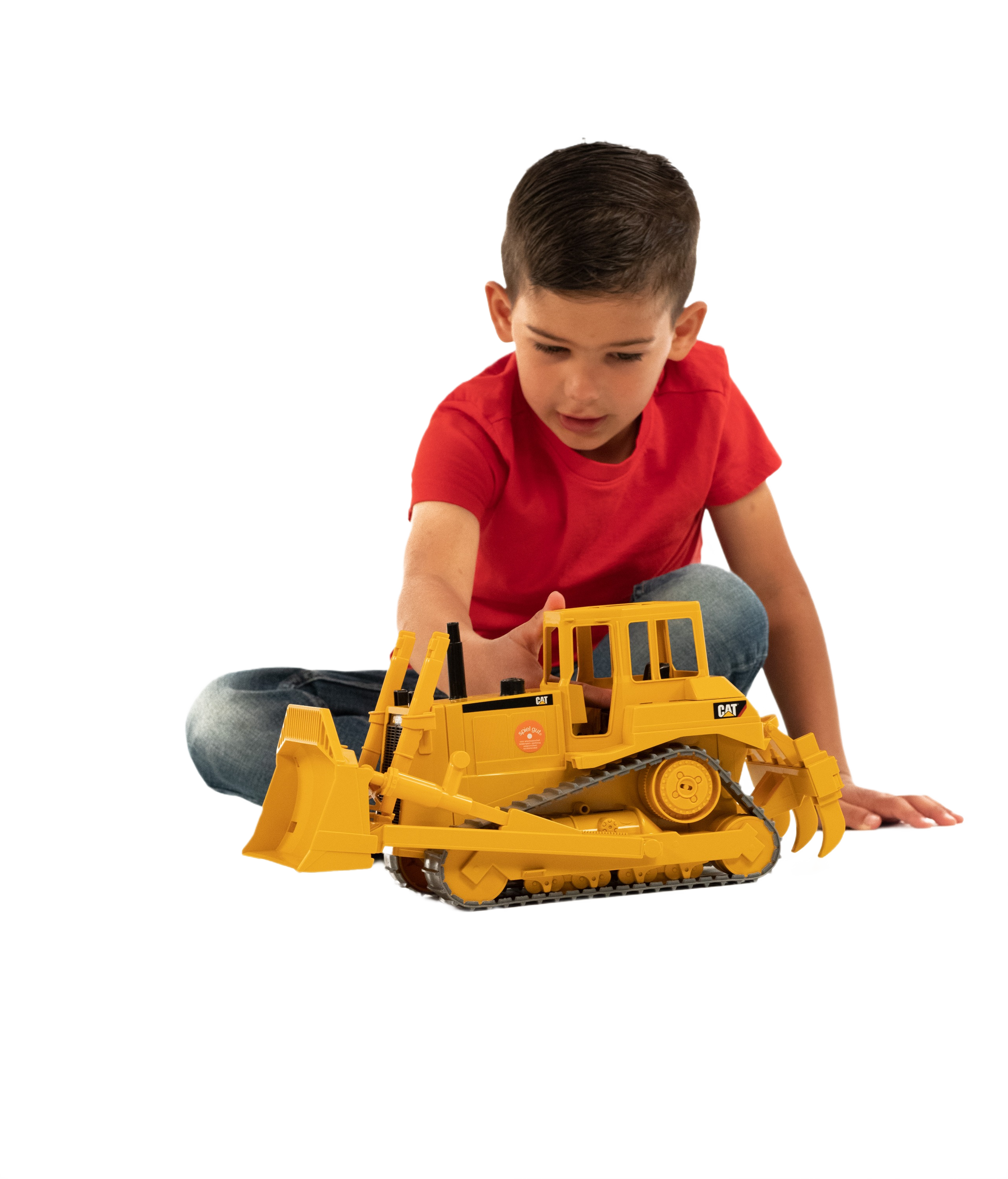 Child playing with detailed Bruder Caterpillar Bulldozer toy featuring realistic tracks and movable front blade for home improvement play