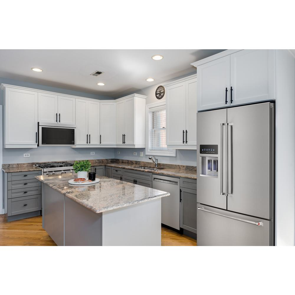Contemporary kitchen with white upper cabinets, gray lower cabinets, granite countertops, stainless steel appliances, and island countertop