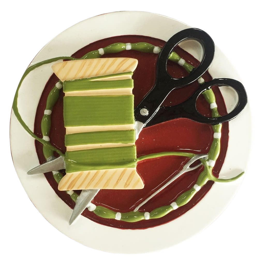 Round sewing-themed ornament with green thread spool, black scissors, and needle for Christmas tree decoration under $50 collection