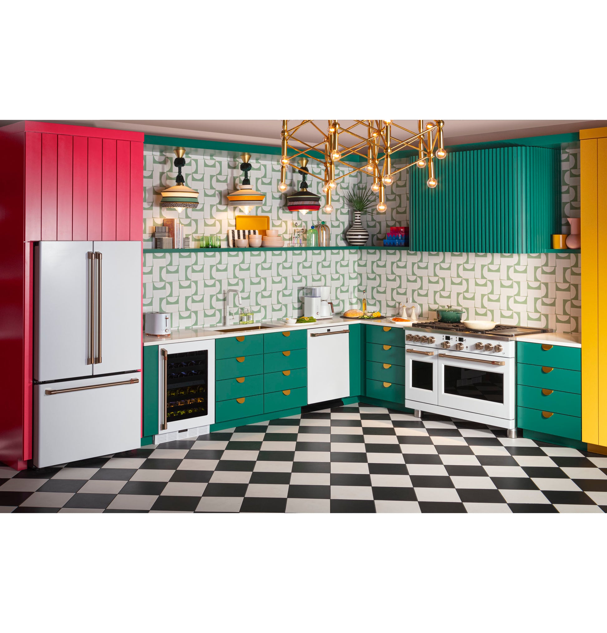 Bright kitchen with green and yellow cabinetry, checkered black and white floor, white appliances, and geometric backsplash tiles