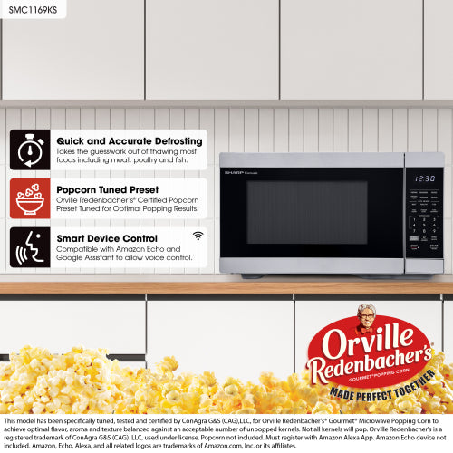 Smart countertop microwave oven with digital controls and stainless steel finish on wooden kitchen counter in appliances setting