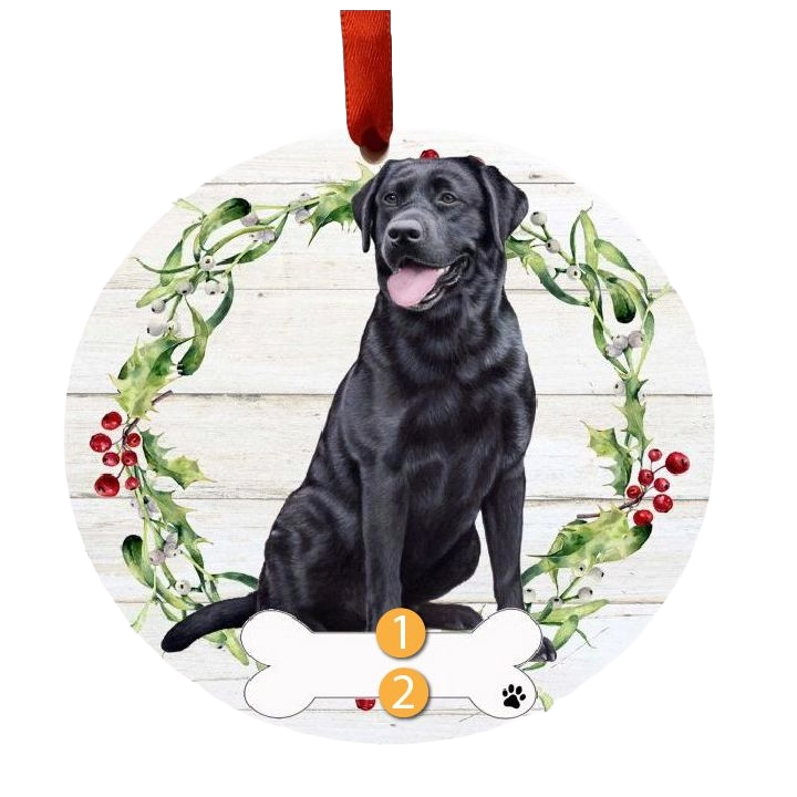 Round Christmas ornament featuring a black Labrador sitting inside a festive wreath with holly and berries