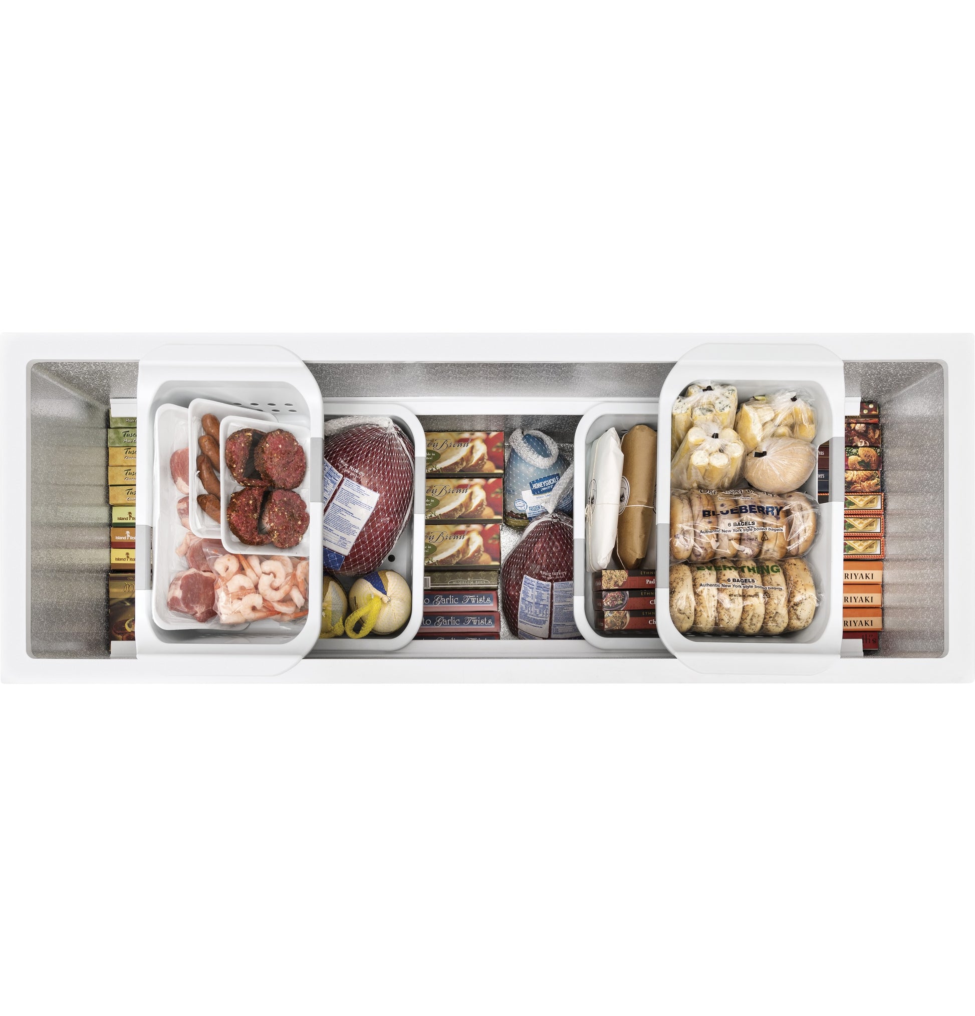 Top view of manual defrost chest freezer filled with various frozen foods in organized baskets for kitchen storage.