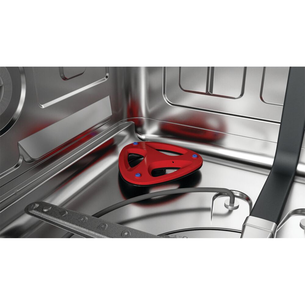 Close-up of stainless steel dishwasher interior focusing on spray arm and red filter in appliances setting