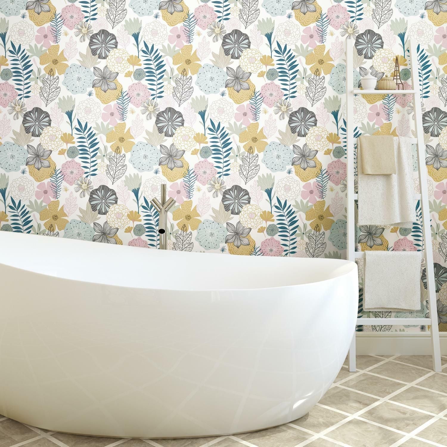 Bathroom scene with floral patterned peel and stick wallpaper in pastel tones behind a modern white bathtub