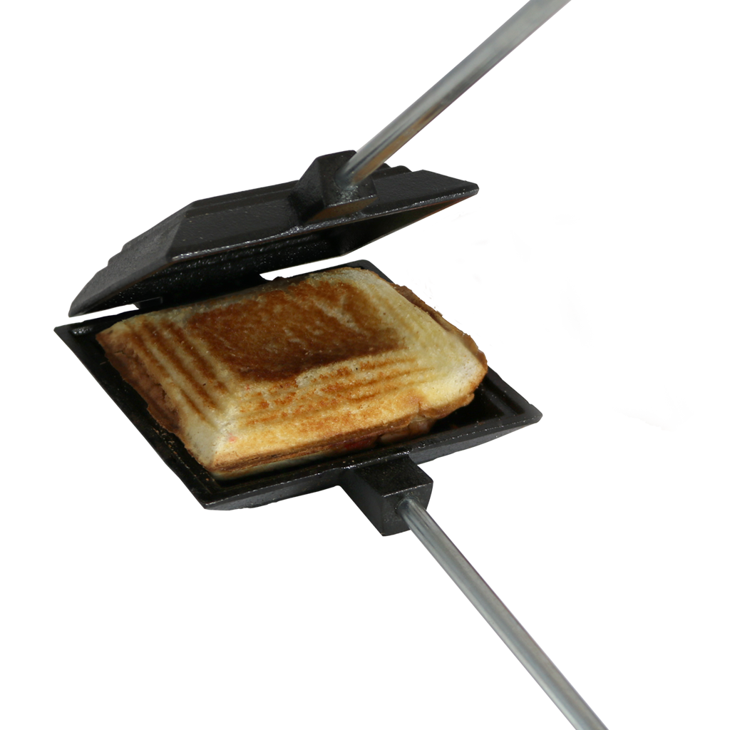 Cast iron pie cooker with long handles grilling a toasted sandwich outdoors for kitchen and grilling use under 50 dollars