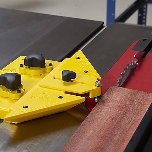 Yellow adjustable rip guide attachment clamped on table saw for precise thin stock cutting in woodworking projects