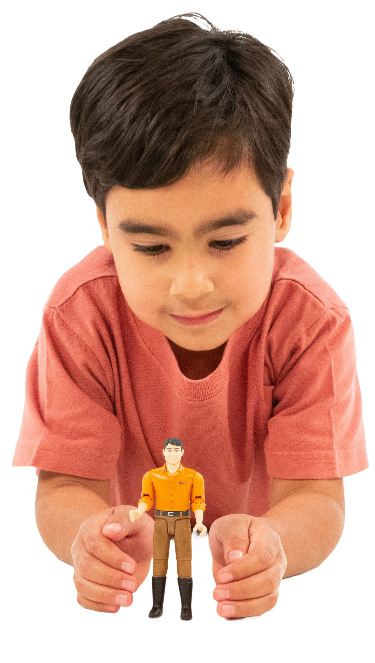Young boy in coral shirt playing with Bruder 60007 man figurine for imaginative tools and home improvement play