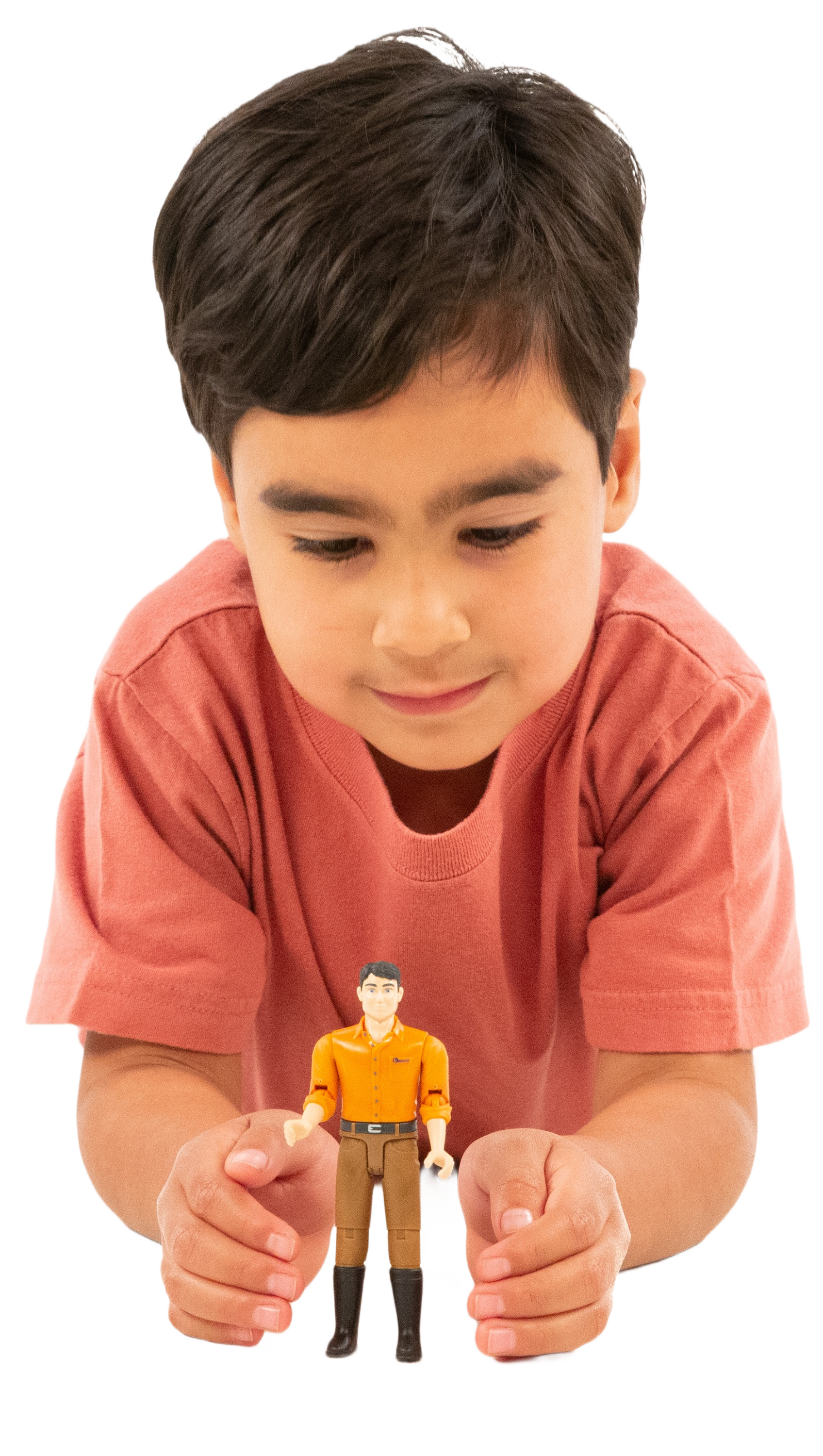 Young boy in coral shirt playing with Bruder 60007 man figurine for imaginative tools and home improvement play