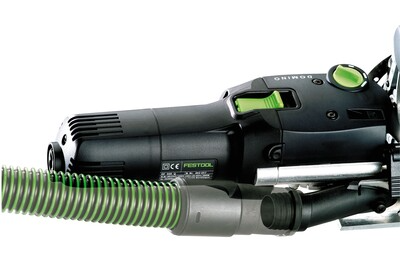 Close-up of Festool Domino woodworking tool with dust extraction hose for precise joinery in power tools collection
