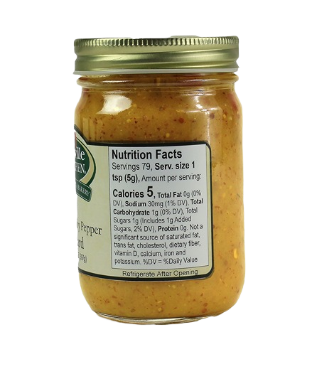 Glass jar of sweet and spicy mustard with nutritional label and gold metal lid for kitchen use