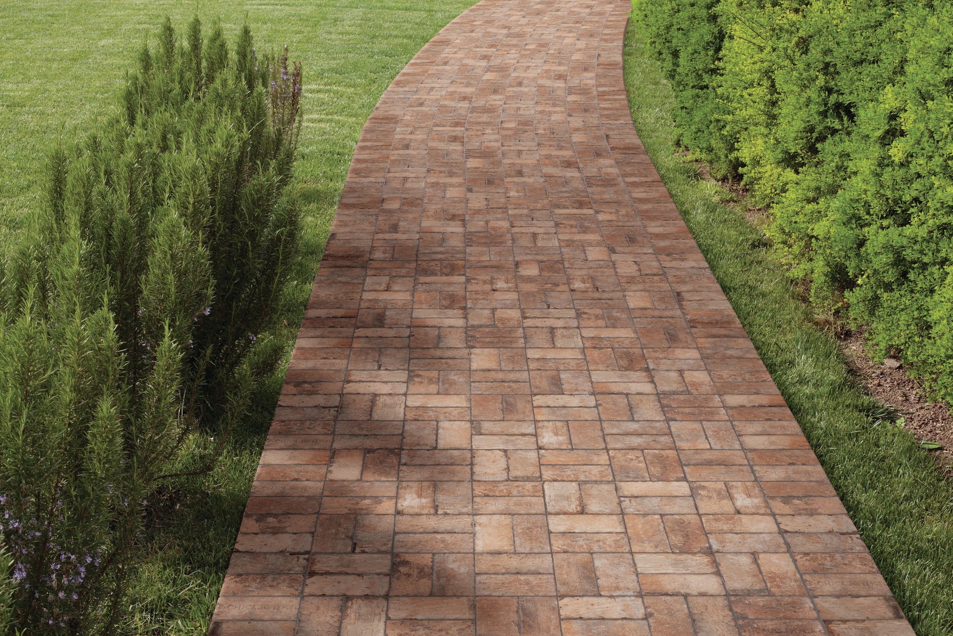 Outdoor walkway paved with warm brown porcelain tiles featuring rustic matte finish for flooring and home improvement projects