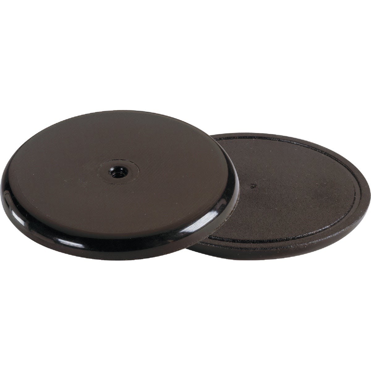 Round black non-skid pads with smooth top surface and textured bottom for home improvement applications