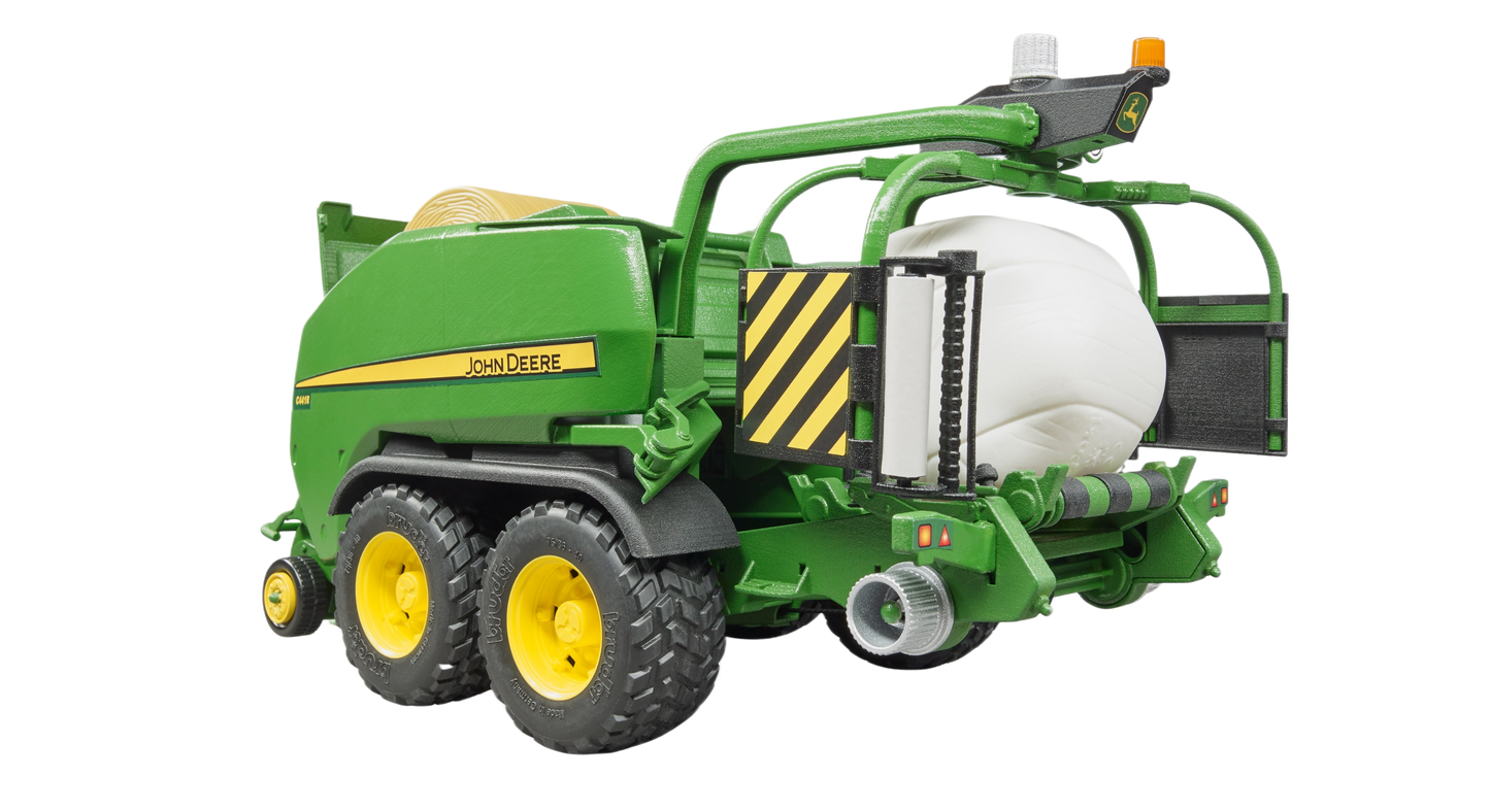 Green and yellow toy wrapping chamber baler with white bale from Bruder Toys in Vehicles & Remote Controlled Toys collection
