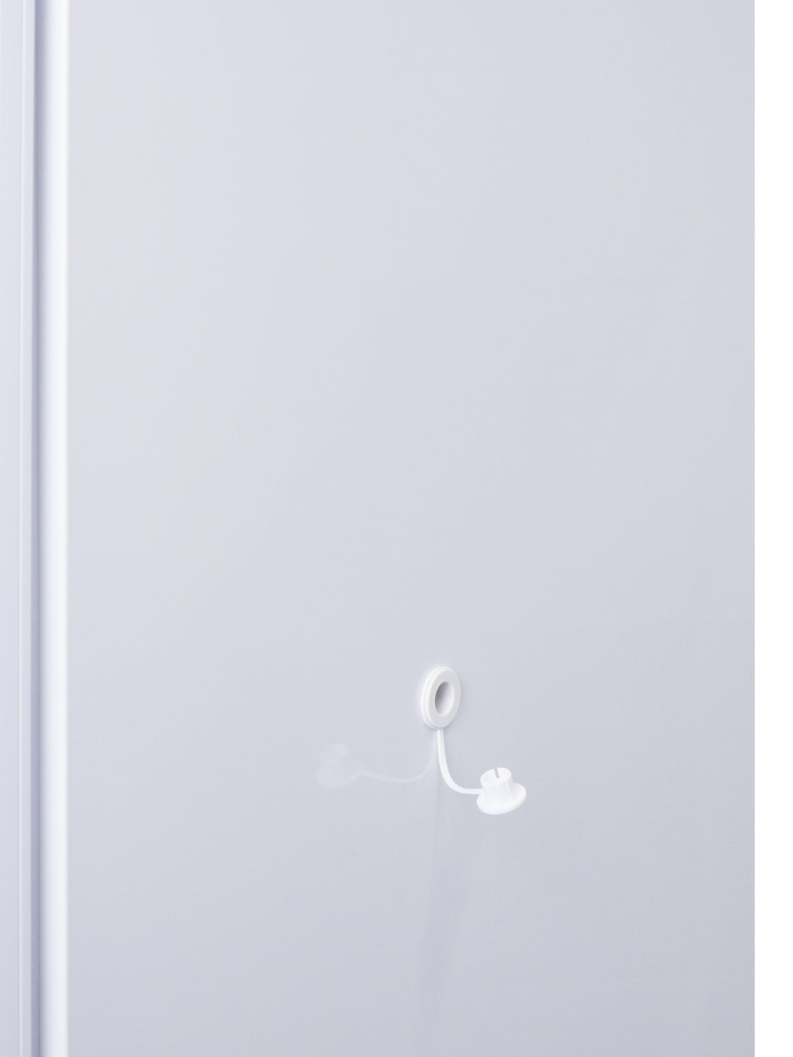 Close-up of white vaccine refrigerator exterior with circular locking mechanism in appliances collection