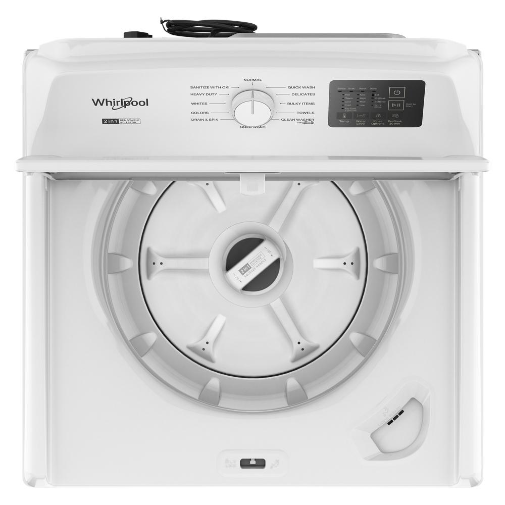 Top view of white Whirlpool top load washer interior with 2-in-1 removable agitator and control dial panel