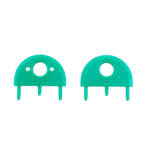 Two green plastic replacement splitters designed for saw accessories in power tool collections