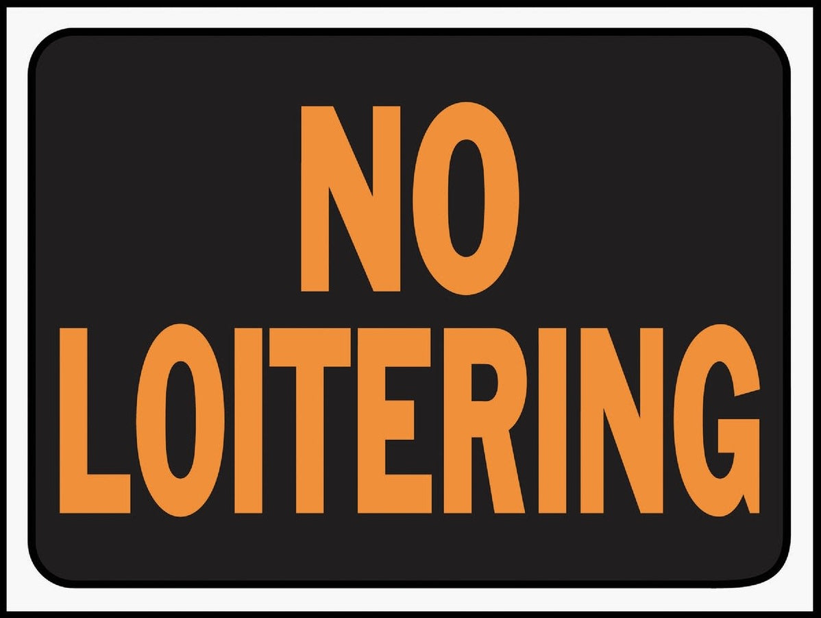 Black rectangular plastic sign with bold orange "No Loitering" text for hardware and home improvement use
