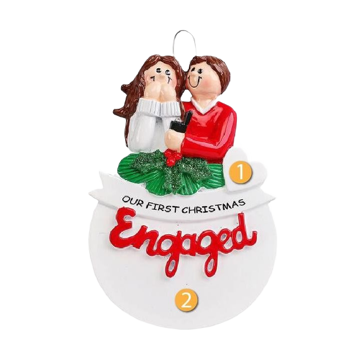Couple figurine holding ring box above wreath with "Our First Christmas Engaged" banner, Christmas decoration under 50