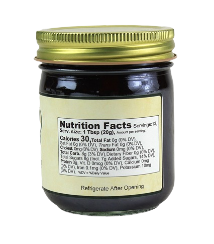 Back view of a small jar of mixed berry spread with gold lid showing nutrition facts in jams and jellies collection