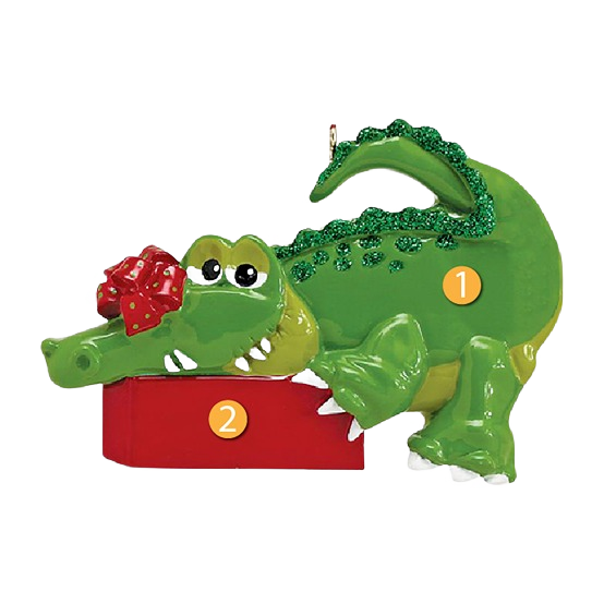 Green alligator Christmas ornament with glitter details holding a red gift box in Christmas Ornaments & Tree Decorations collection