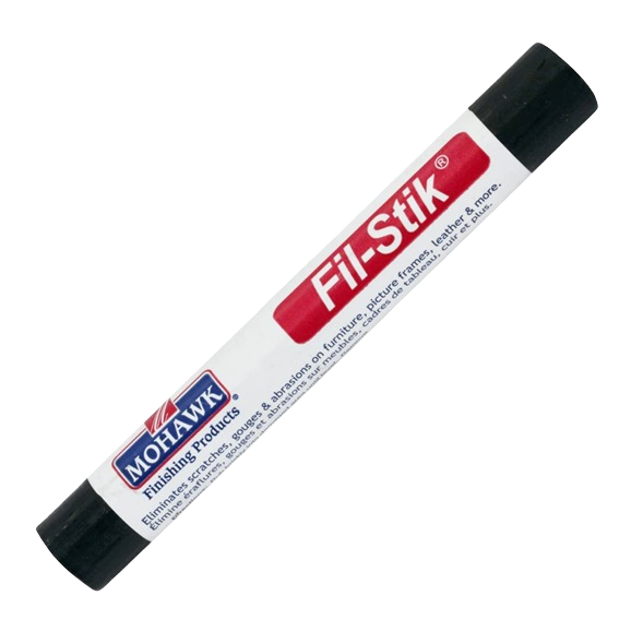Dark ebonized cherry wood repair putty stick for filling scratches and nicks in wood surfaces