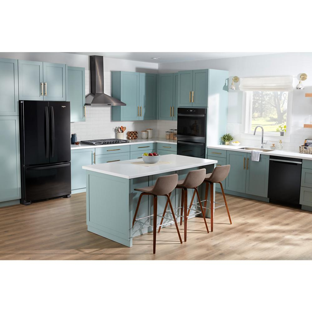 Modern kitchen with pastel blue cabinetry, black appliances, kitchen island with seating, and wood-look flooring in cooktops collection