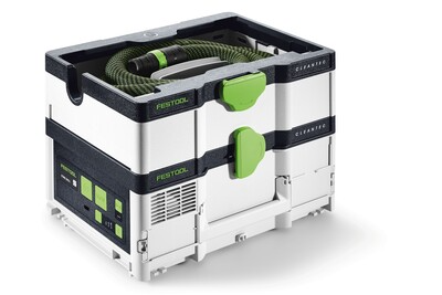 Compact white and black mobile dust extractor with green latches and hose for dust collection in woodworking tools.