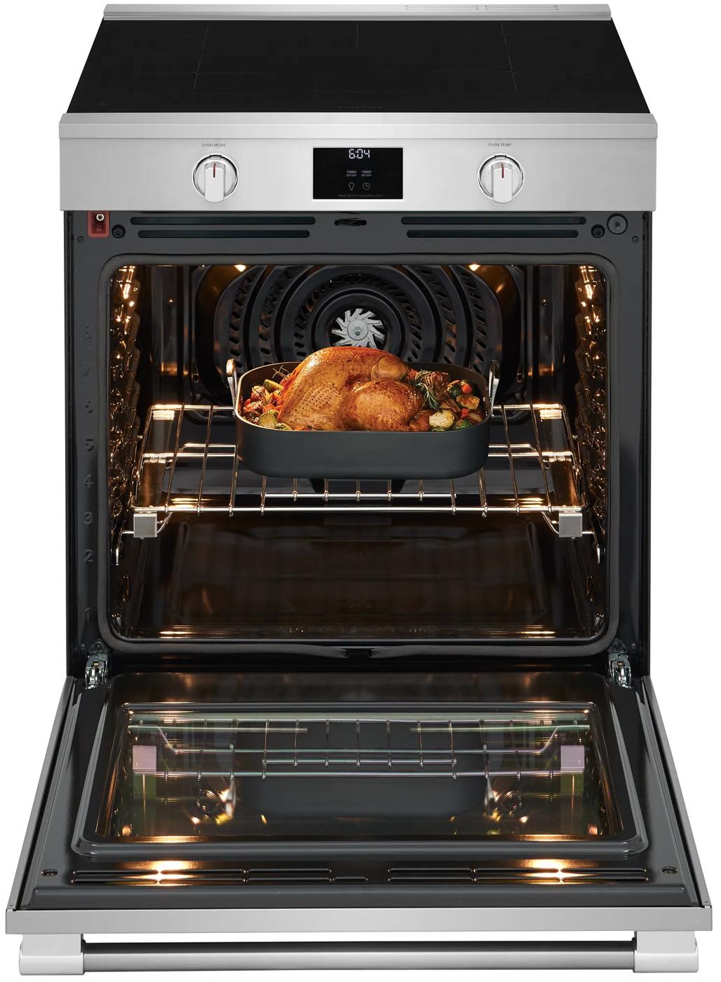 Open stainless steel 30-inch induction range from Ranges & Kitchenware with roasted turkey inside oven at Hartville Hardware