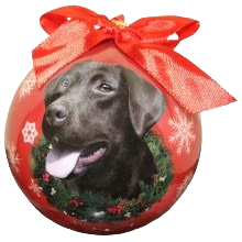 Red Christmas ball ornament featuring a realistic chocolate Labrador dog with festive snowflakes and a red ribbon bow