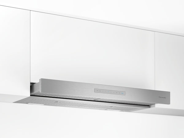 Stainless steel custom insert hood installed under white cabinetry in modern kitchen setting, in Over the Range Hoods collection