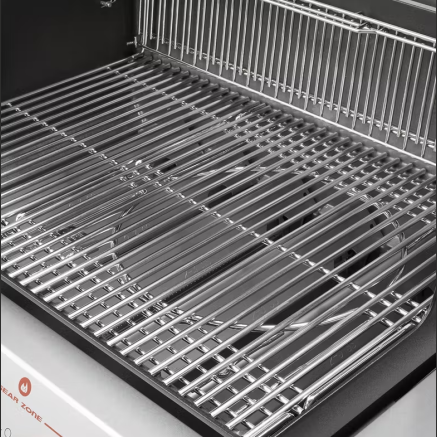 Close-up view of stainless steel grilling grates inside a premium natural gas grill for outdoor cooking