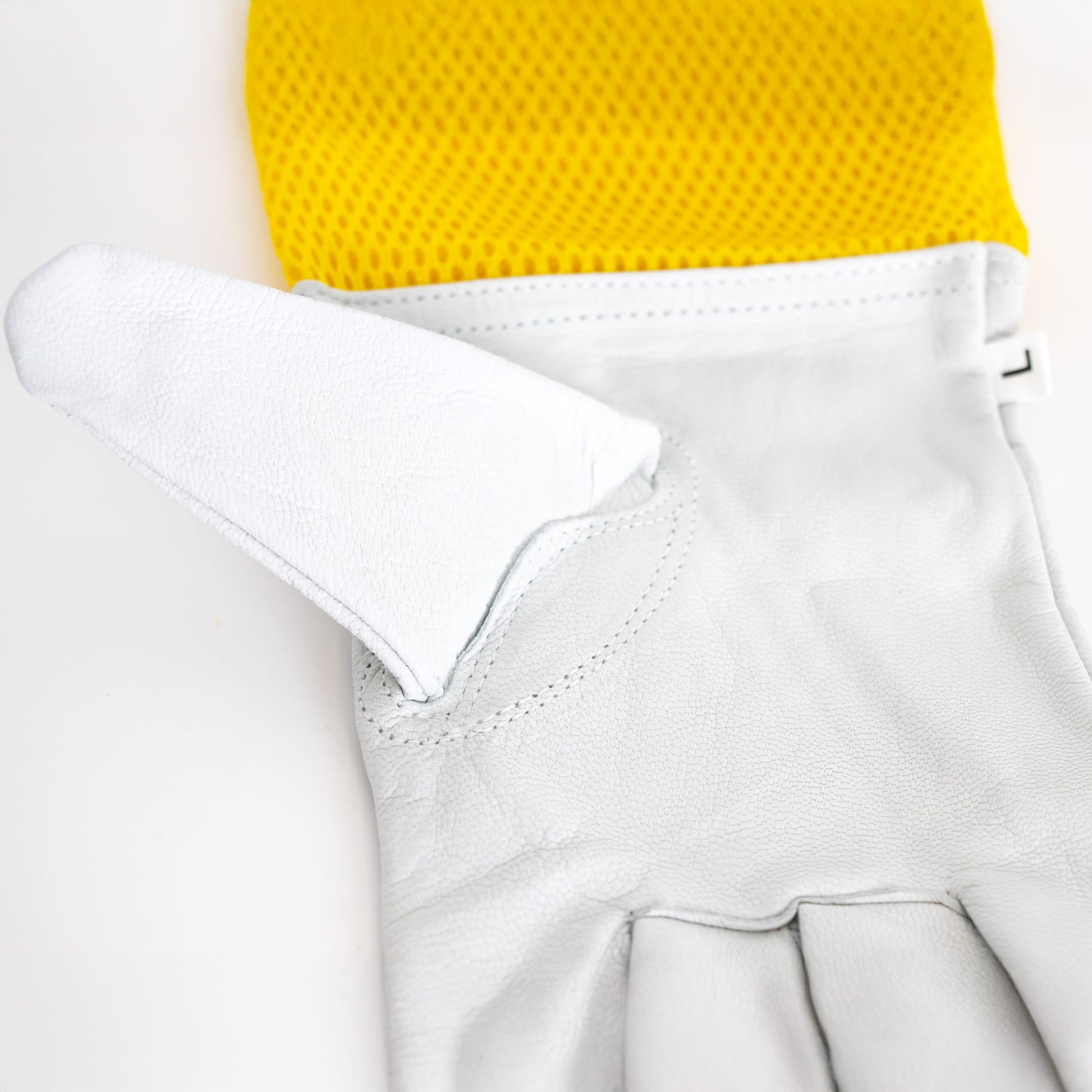 Large goatskin work glove with breathable yellow mesh back and reinforced thumb for beekeeping and home improvement tasks