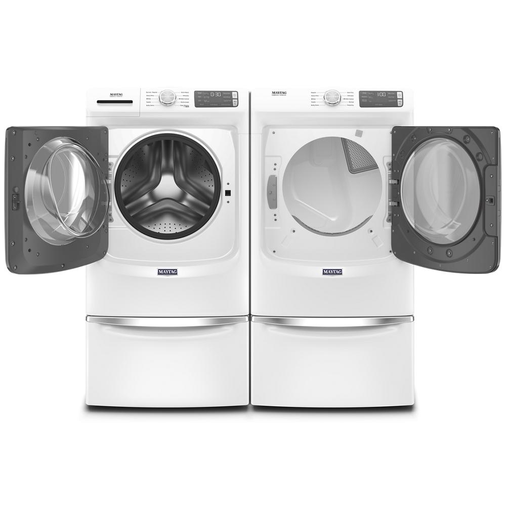Pair of white front load washer and dryer with open doors and digital control panels in appliance category