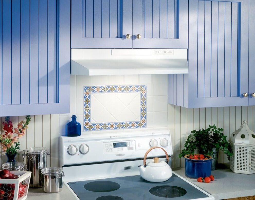 White convertible under-cabinet range hood installed over an electric stove in a traditional kitchen setting