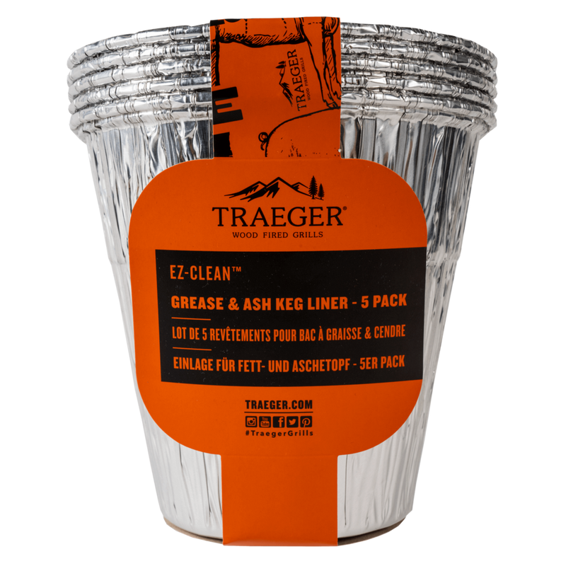 Stack of silver disposable grease and ash liners with orange Traeger label for grill cleaning accessories under $50