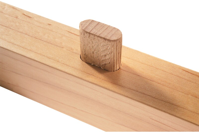 Close-up of a beech wood tenon securely fitted into a light wood joint for woodworking tool accessories collection