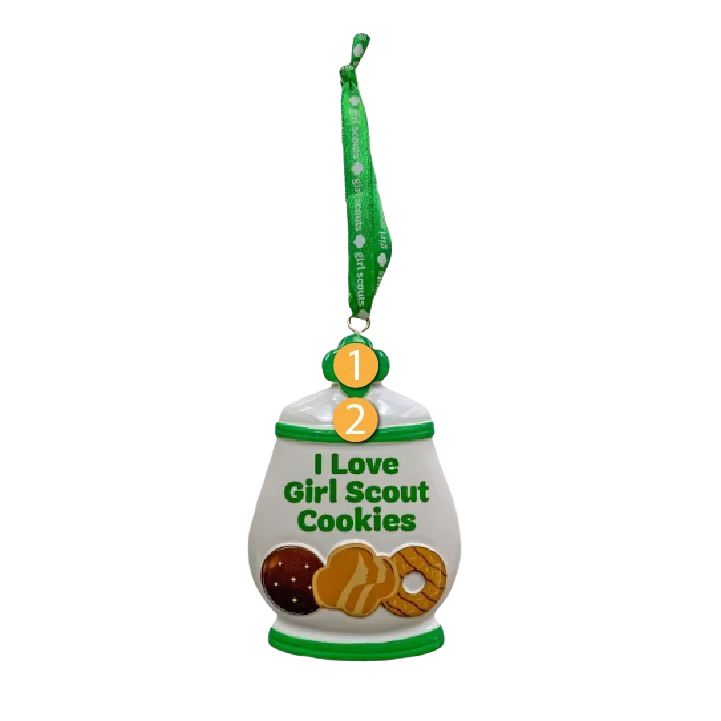 Ceramic jar-shaped ornament with green accents, Girl Scout cookie illustrations, and green ribbon loop for hanging