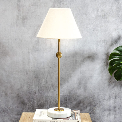 Table lamp with brushed gold stand and white marble base, ideal for lighting and home improvement decor projects