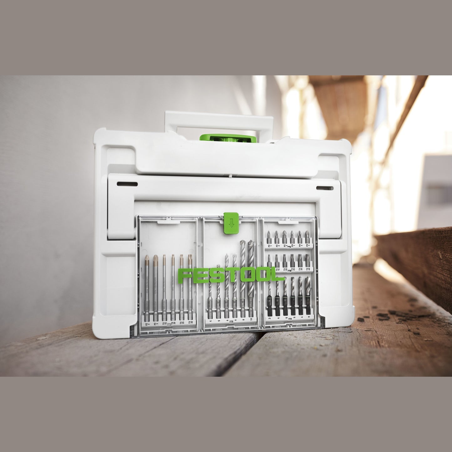 White Festool Systainer with transparent lid compartment holding organized drill and screwdriver bits for workshop storage