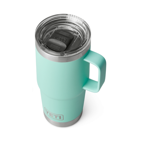 Mint green 20 oz. insulated YETI Rambler travel mug with handle and clear Stronghold lid, durable drinkware for kitchen and outdoor use collections