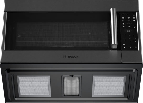 Top view of black stainless steel over-the-range microwave with digital control panel and side-opening door in kitchen appliances collection