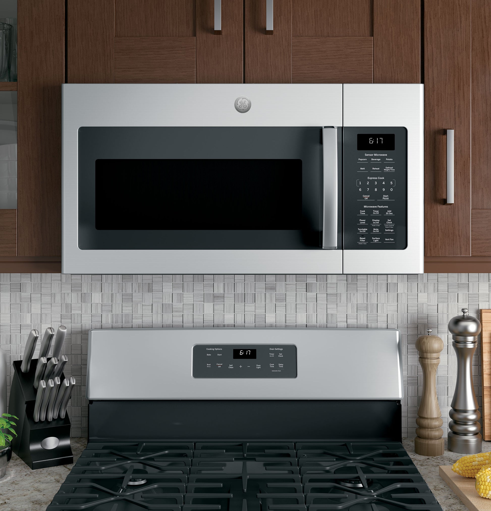 Stainless steel over-the-range microwave with digital control panel and sensor cooking in kitchen appliances collection