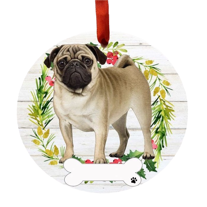Round Christmas ornament featuring a beige pug standing inside a holiday wreath with red berries and greenery