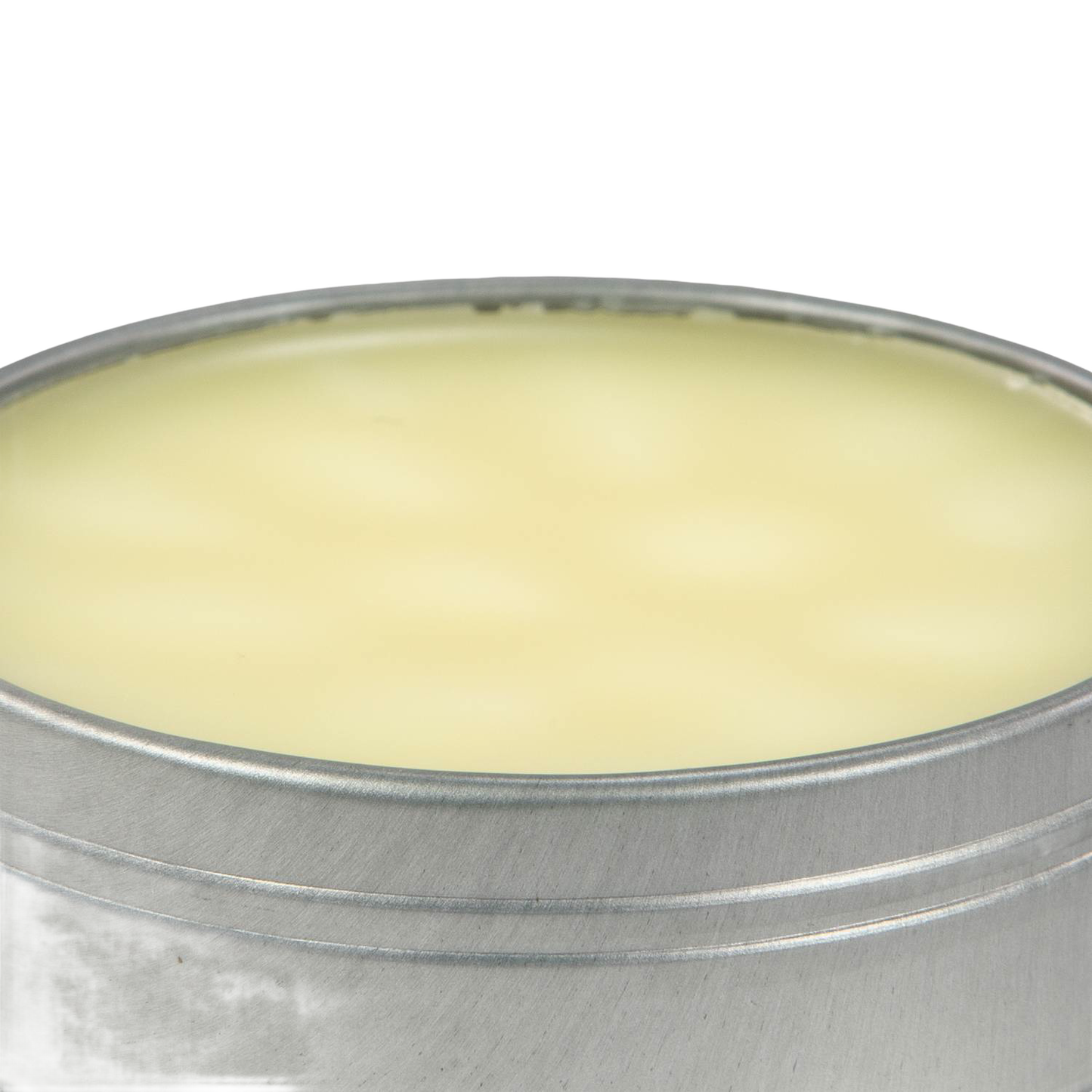 Open metal tin filled with pale yellow cast iron seasoning wax, in Kitchenware under $50 collection